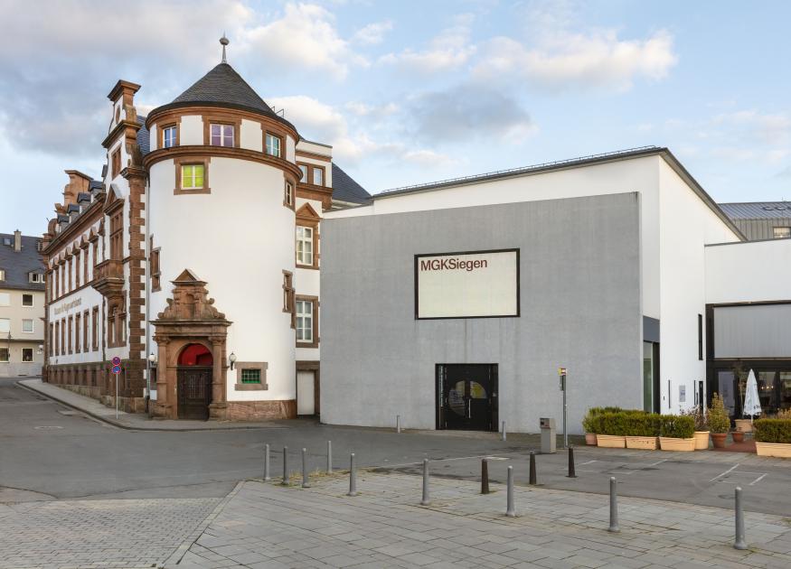 View of the facade of MGKSiegen on a sunny but cloudy day